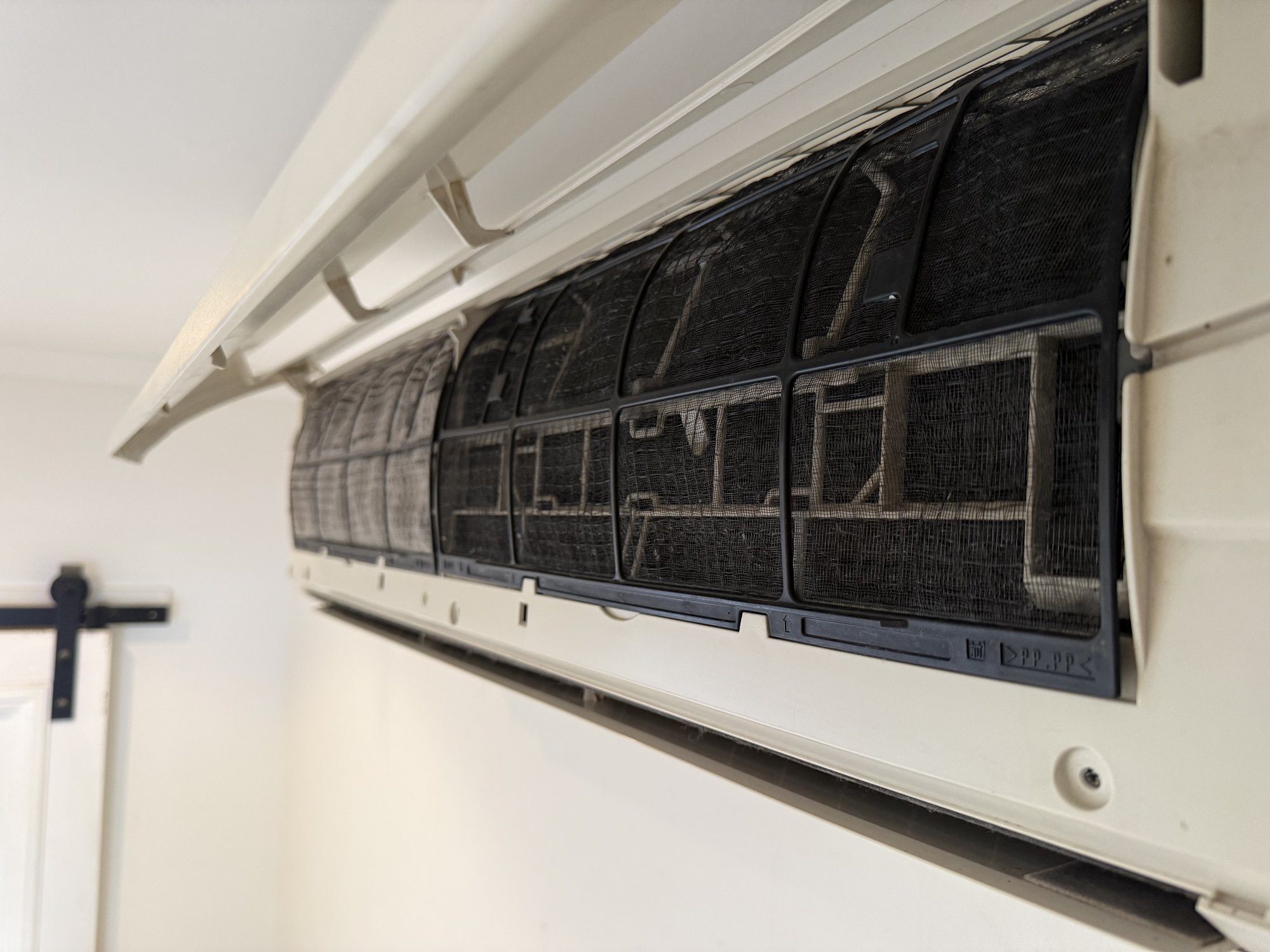 Clean air conditioner filter after professional cleaning in Townsville